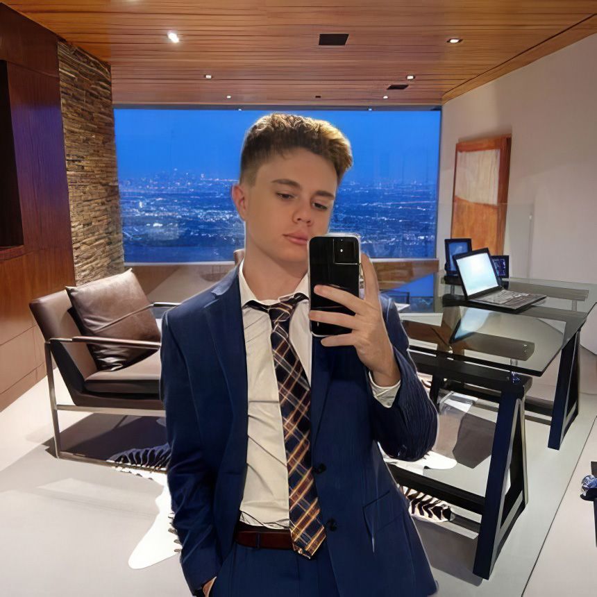 Jacob Hutiu taking a selfie in an office